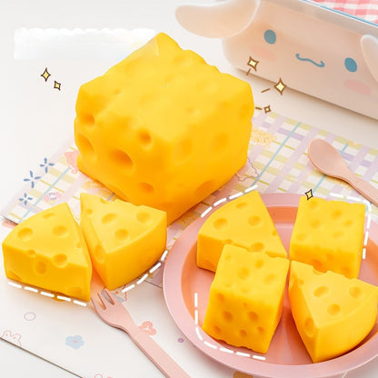 Cheese squishy, Yellow cheese-like blocks on a pink plate with a cartoon cow in the background